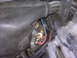 1995 Ford Bronco - A close-up view of a brass sensor with electrical connections, likely part of the engine's sensor system.