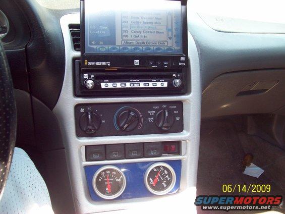 100_1067.jpg cd player with fold out screen and temp and oil pressure gauges