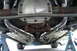 2002 Ford Mustang - The undercarriage of a 2002 Ford Mustang shows a dual exhaust system with polished pipes leading to the rear axle.