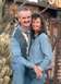 1993 Ford Taurus - A smiling couple poses for a photo in an outdoor setting with cacti and rustic structures.