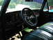 1979 Ford Bronco - Interior view of a 1979 Ford Bronco, showing the dashboard, steering wheel, and front bench seat.