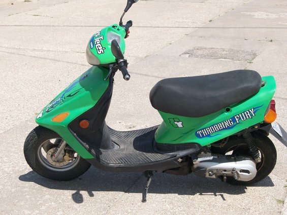 Green scooter with "THROBBING FURY" text on the side