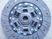 1993 Ford Probe - A clutch disc, identified by "Flywheel Side" text, is shown with its internal springs and friction material.