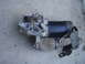 1993 Ford Probe - A starter motor assembly, likely for a vehicle, is shown resting on a concrete surface.