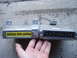 1993 Ford Probe - Two automotive electronic control units are shown side-by-side, with a hand holding them for scale.