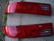 1993 Ford Probe - Two red taillights are shown, likely for a car, with visible text imprinted on the lenses.