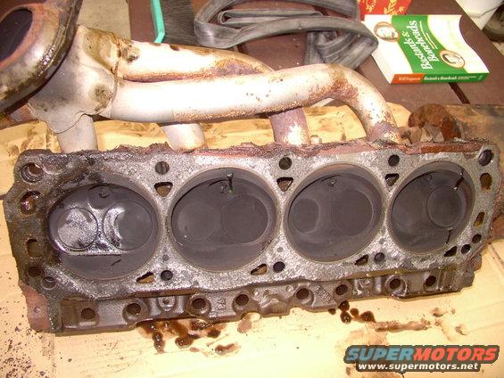 img_0047.jpg Think I'll put the headers and header gaskets back on the heads before I put the heads on the block. Might even index the plugs while the heads are off.