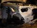 1995 Ford Taurus - The front end of a car is shown with the hood open, revealing the engine bay and suspension system.