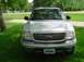2001 Ford Expedition - Front view of a silver 2001 Ford Expedition, its distinctive chrome grille and a license plate from Iowa.
