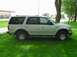 2001 Ford Expedition - Side view of a 2001 Ford Expedition parked on a grassy lawn.