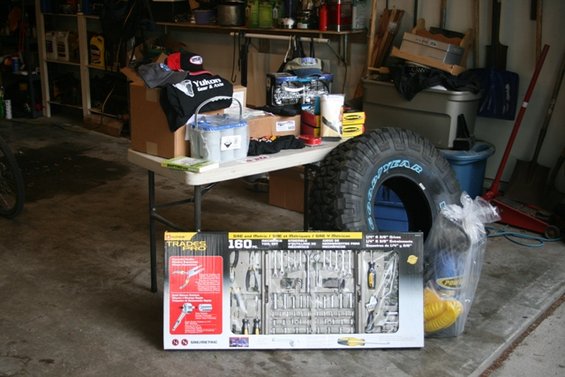 Tool chest and large tire in a garage setting