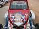 1993 Ford Taurus - Custom red dune buggy with flame graphics is seen from the front.