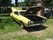 1972 Ford Ranchero - A yellow 1972 Ford Ranchero is displayed with its hood open at an outdoor event.