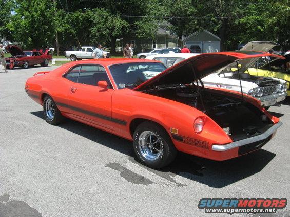 1972 Ford Ranchero GT with hood open, parked at an outdoor car show
