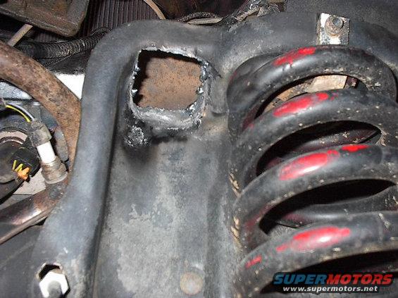Another shot of cutout on passenger side to pass the shock through.