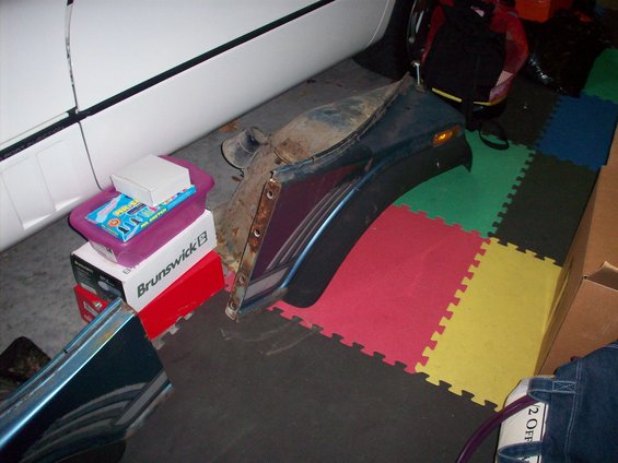 Blue fender with rust and orange turn signal