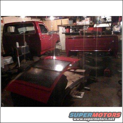 Red 1994 Ford F-250 disassembled in garage