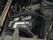 1984 Ford Bronco - Battery was relocated to the passenger side, opposite of where it should be, and is held in place with a bungee cord.