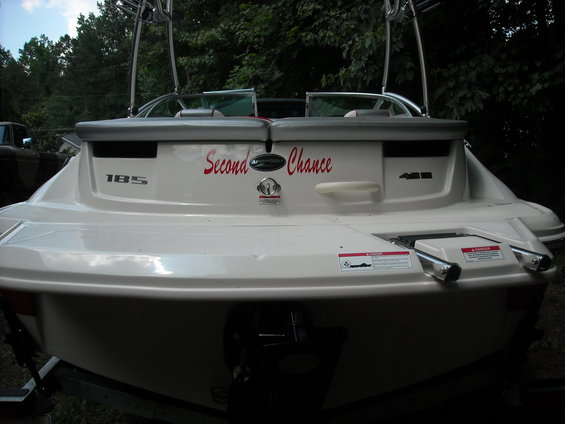 Stern of a white boat with 'Second Chance' in red script, model number 185, and 4.3L designation
