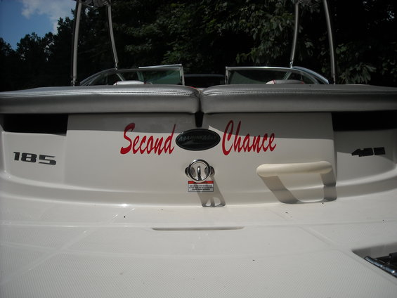 Boat stern with red lettering saying "Second Chance" and "185" and "420" model numbers