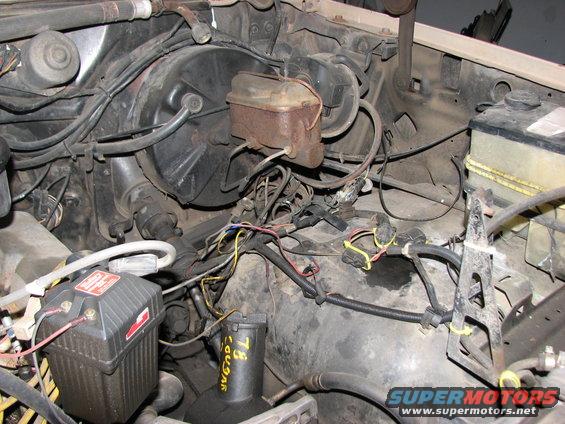 Better view of the wiring mess. Note the empty battery tray on the right. Hopefully this will all get cleaned up.
