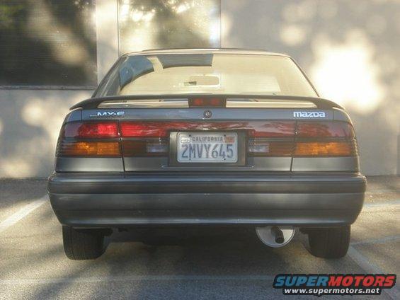 Rear view of a 1989 Mazda MX-6 with a California license plate