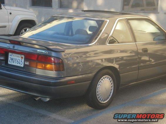Gray 1988 Mazda MX-6 coupe, rear 3/4 view, with a spoiler and California license plate 2MVY645