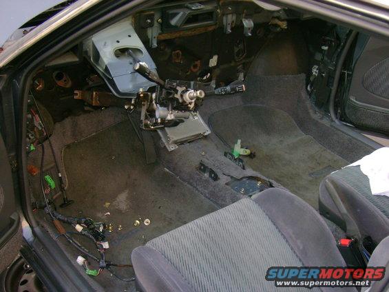 Interior of a car with dashboard removed and wiring exposed