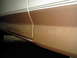 1995 Ford Bronco - Close-up of a vehicle's side panel showing a two-tone paint scheme and pinstripes.
