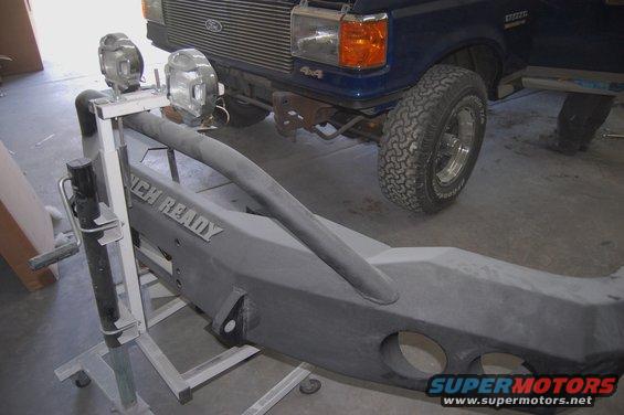 Blue 1989 Ford Bronco front end with aftermarket bumper and lights