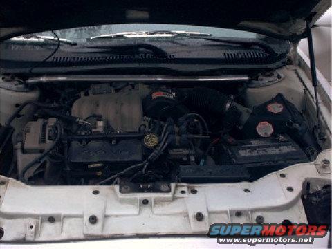 1997 Ford Taurus engine bay with 3.0 V6 badge visible