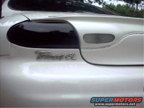 White 1997 Ford Taurus GL rear with tinted taillights and a Supermotors.net watermark
