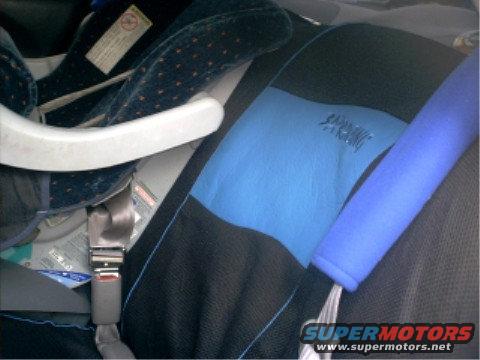 Child car seat installed on vehicle seat with seatbelt