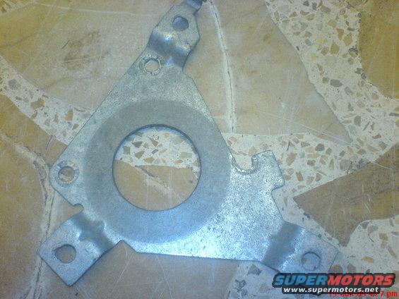 Metal bracket with circular cutout and mounting holes
