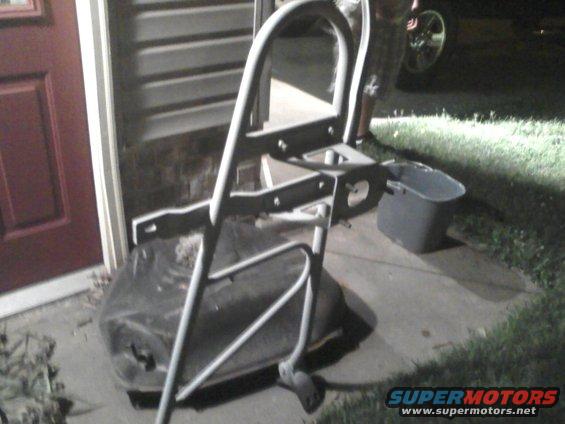 Metal frame part with a black tank underneath