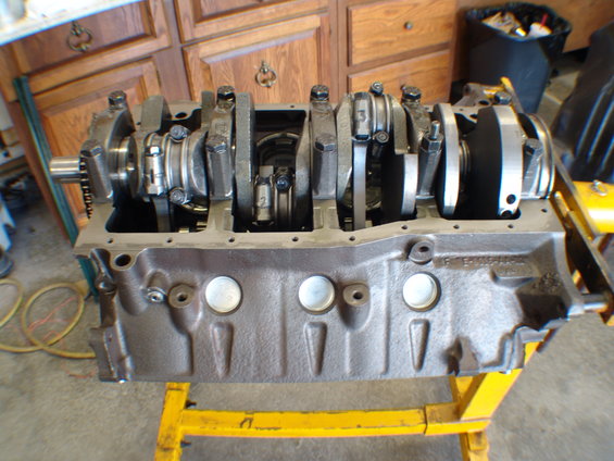 Engine block with crankshaft and connecting rods visible