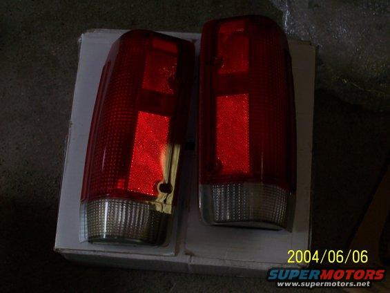 Pair of red taillights on a white box