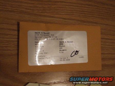 Envelope with Smith & Wesson pistol details, including serial number and date