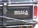 1994 Ford F-250 - The tailgate of a truck displays a sticker with a common saying and a memorial.