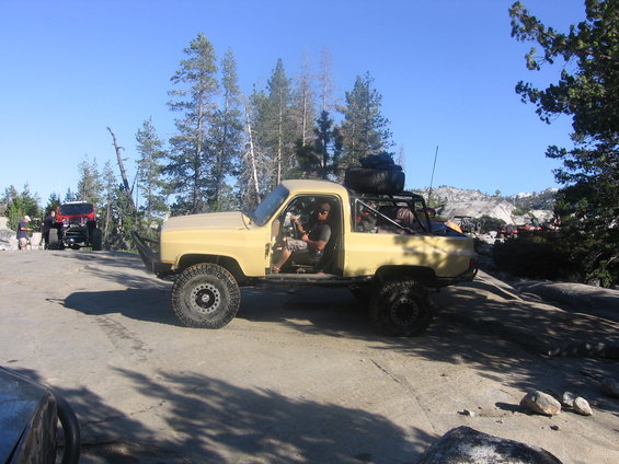 Yellow pickup truck, 3/4 front view, appears to be from the 1980s