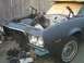 1973 Ford Ranchero - The front end of a car, possibly a 1973 Ford Ranchero, is shown with its hood open and engine removed.