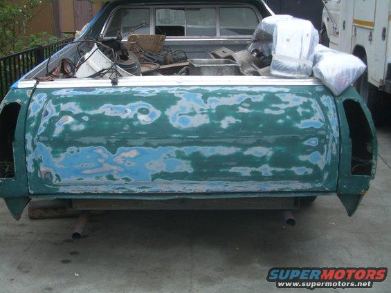 Green Ford Ranchero rear, bodywork in progress with primer and filler visible