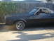 1973 Ford Ranchero - Side view of a black 1973 Ford Ranchero custom chrome wheels.