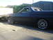 1973 Ford Ranchero - Side view of a 1973 Ford Ranchero, custom chrome wheels and a matte black finish.
