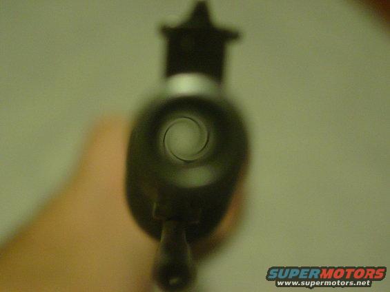 view down a dark barrel with rifling visible