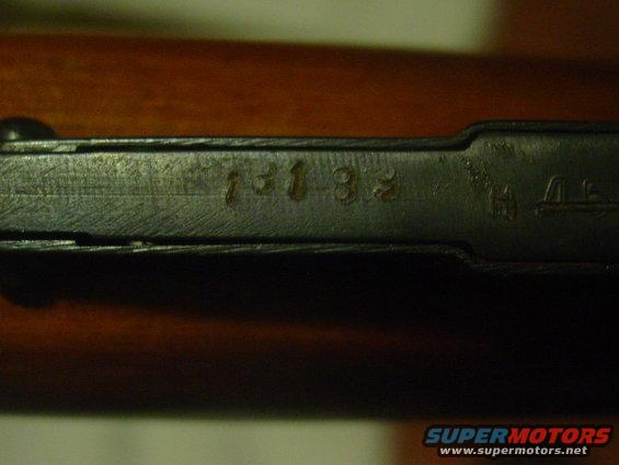 Metal part with stamped numbers '131 33' and other symbols