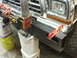 1979 Ford Bronco - A new custom steel bumper is being installed on a Ford Bronco, with a level ensuring it's straight.