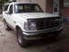 1995 Ford Bronco - This 1995 Ford Bronco is parked in front of a brick building.
