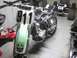 2004 Honda TRX 400 EX - A dirt bike, partially disassembled, displays the number 911 on its front plate.