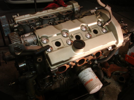 Engine with beige valve covers and visible oil filter